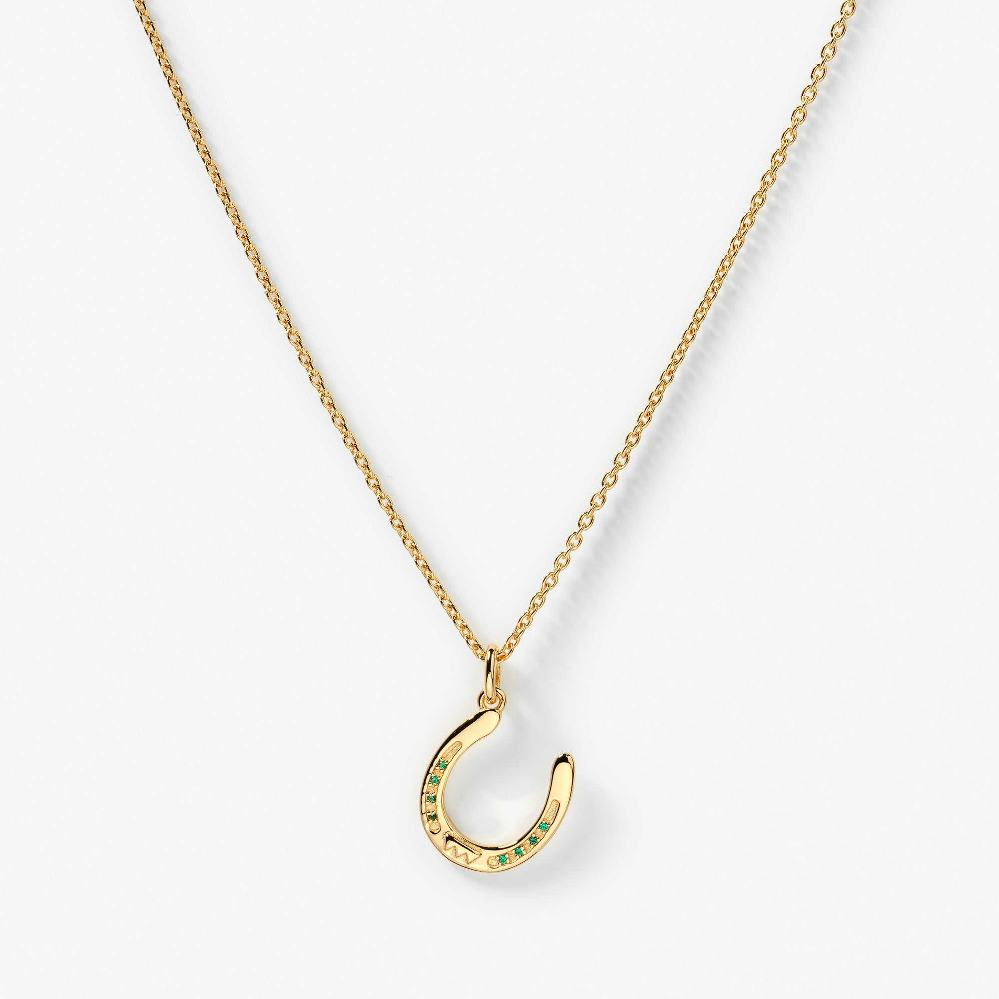 GetTheGallop_necklace_gold_horseshoe_green_stones.jpg